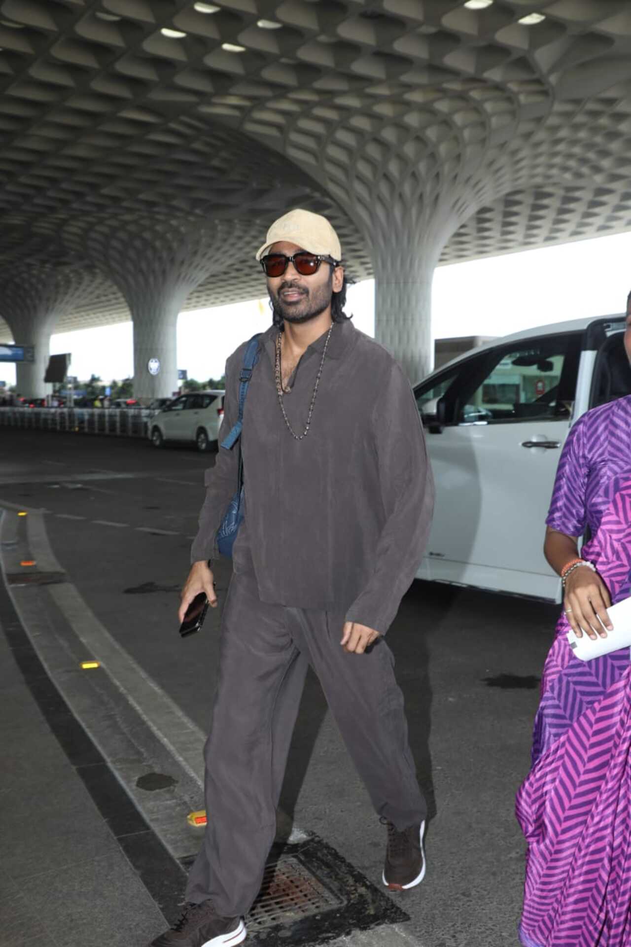 Actor Dhanush was seen leaving the city on Friday morning as he was spotted at the airport in a cool and comfy wear.